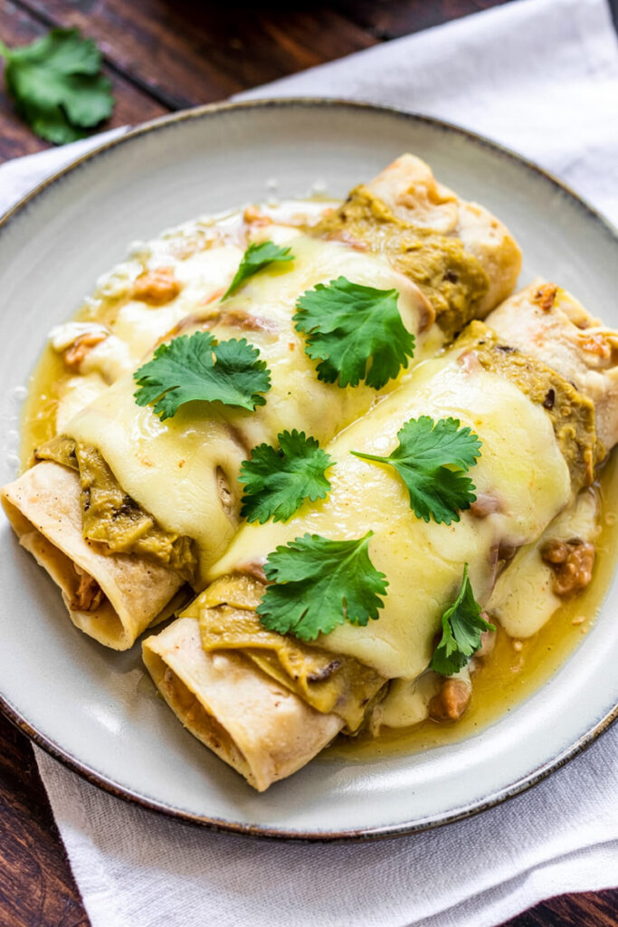 Serving Chicken Enchiladas With Green Sauce